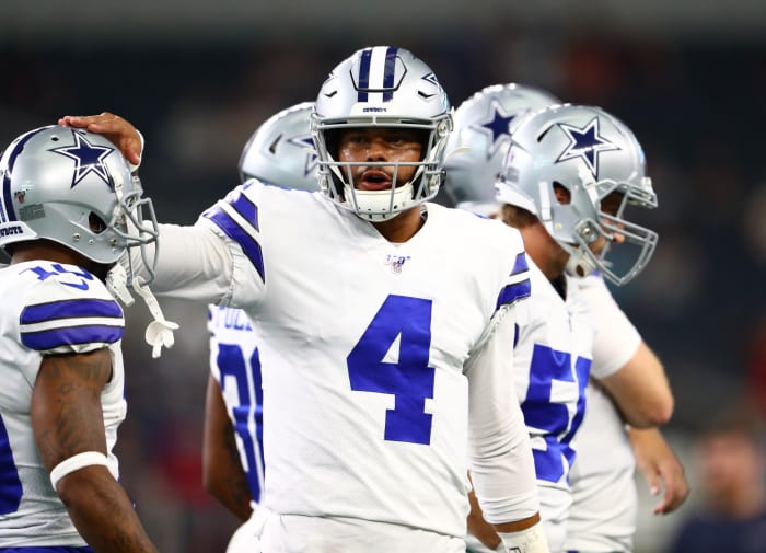 Aug 24, 2019; Arlington, TX, USA; Dallas Cowboys quarterback Dak Prescott (4) pats the helmet of receiver Tavon Austin (10) prior to the game against the Houston Texans at AT&T Stadium.